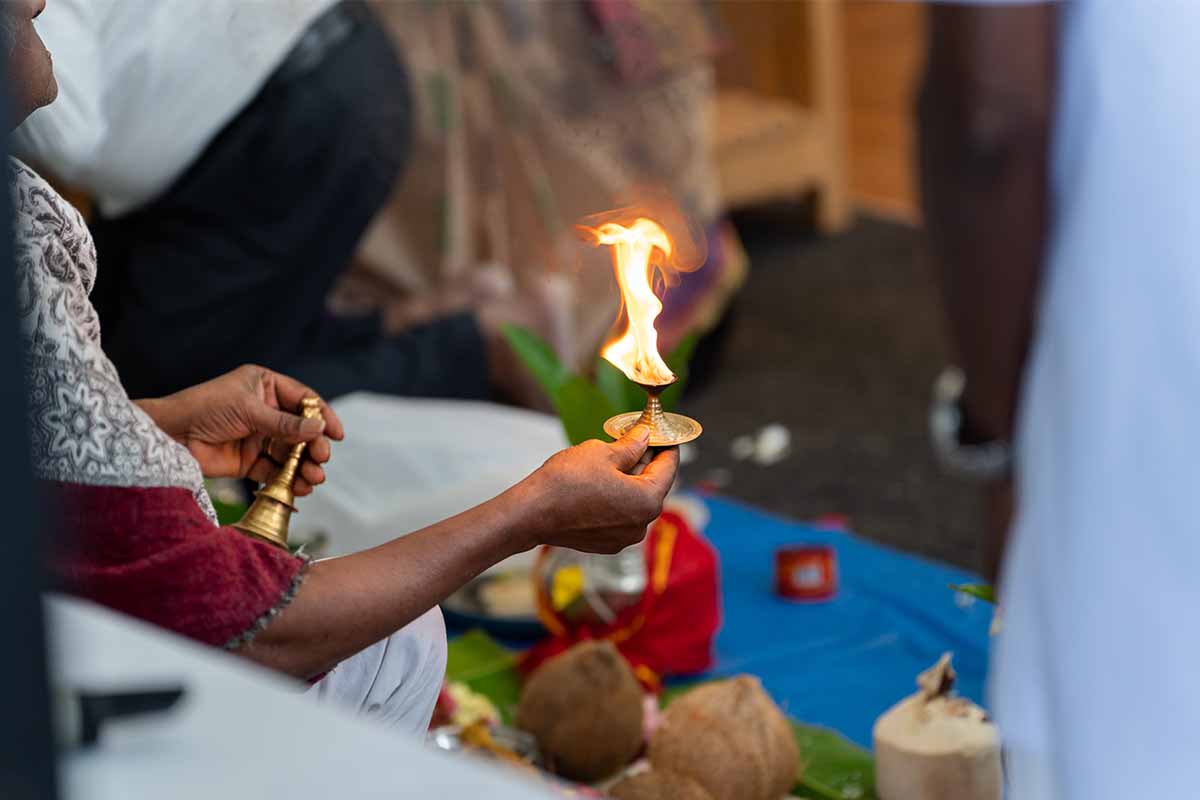 Hindu service burning candle